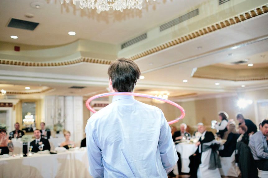 Man and a hoola hoop captured by best Toronto wedding photographer.
