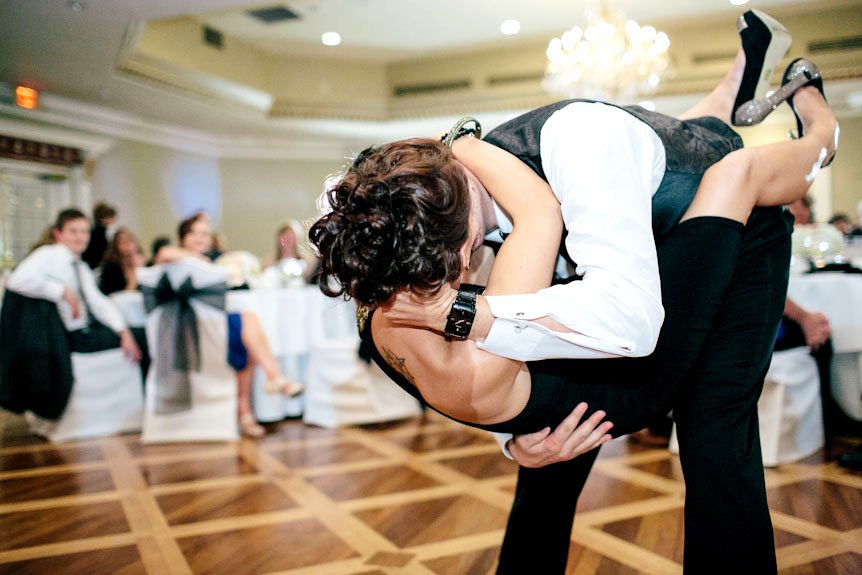 The groomsman and his fiancee make out on the dance floor.