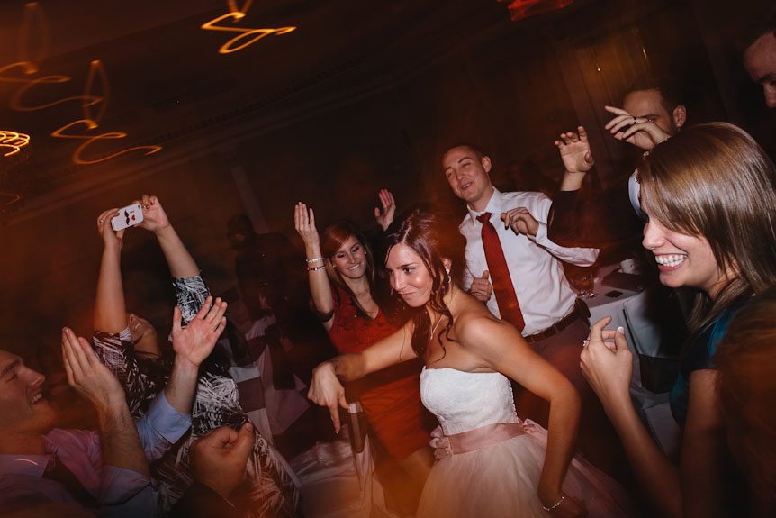 The bride dances with her guests at their Queen's Landing Hotel wedding reception.