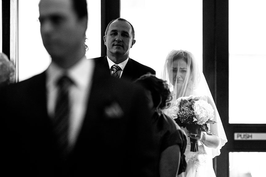 An image of an emotional bride before she walks down the aisle.