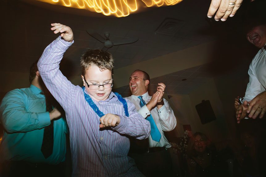 Little boy dancing to Gangnam Style at a wedding reception.