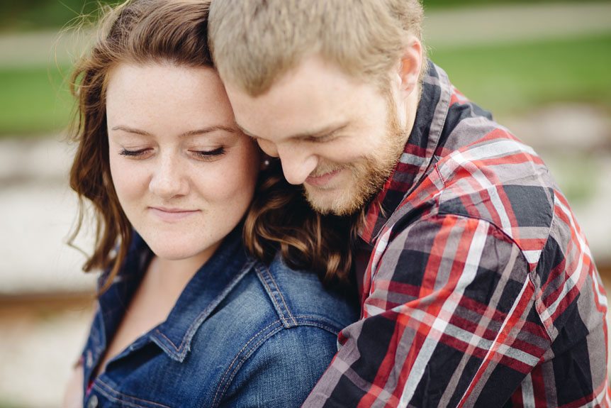 A young couple's romantic engagement portrait in Guelph.