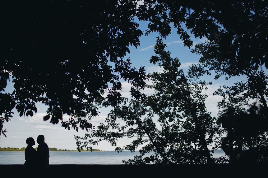 Artistic silhouette of a couple for their engagement session shot at Toronto Islands.
