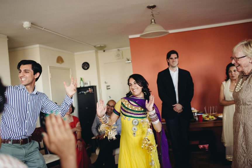 The bride dancing to Indian music.
