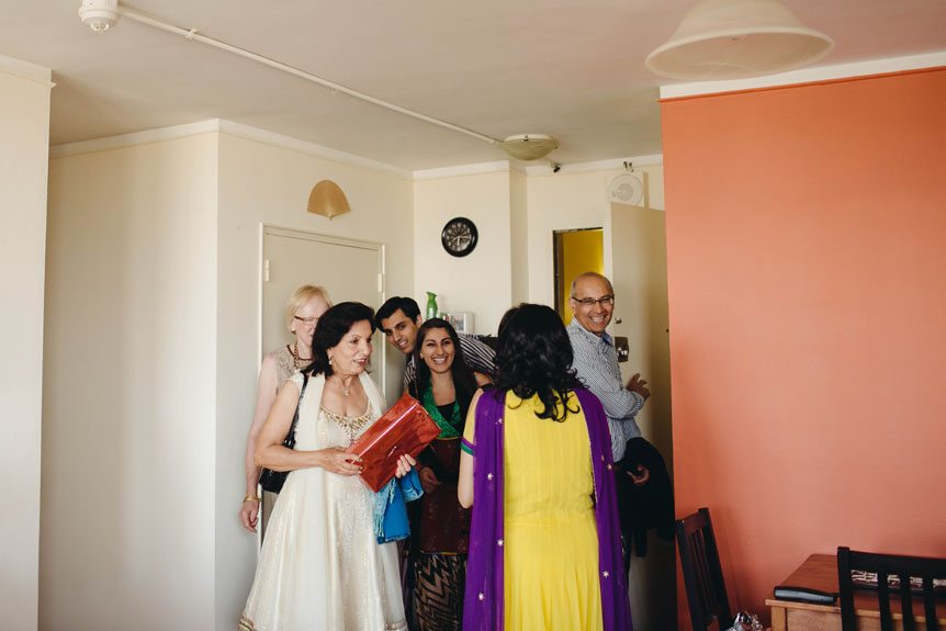 Guests at a mehendi ceremony arrive.