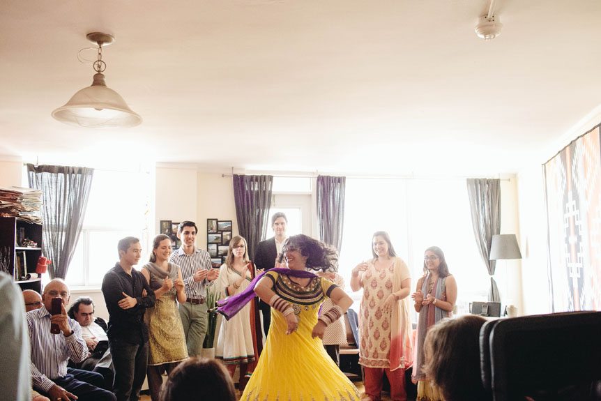 An Indian bride performs a dance number for her friends and families.