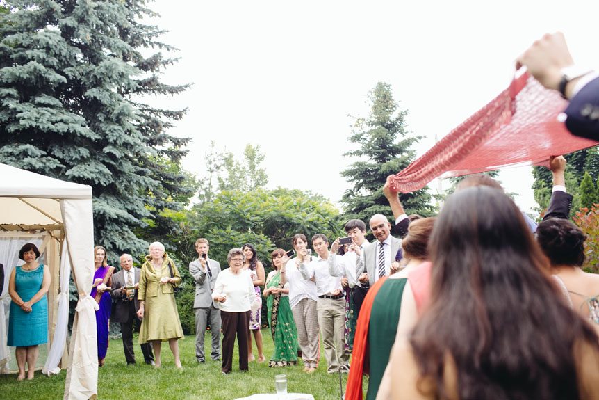 The guests welcomes the bride on her intimate backyard wedding in Toronto.