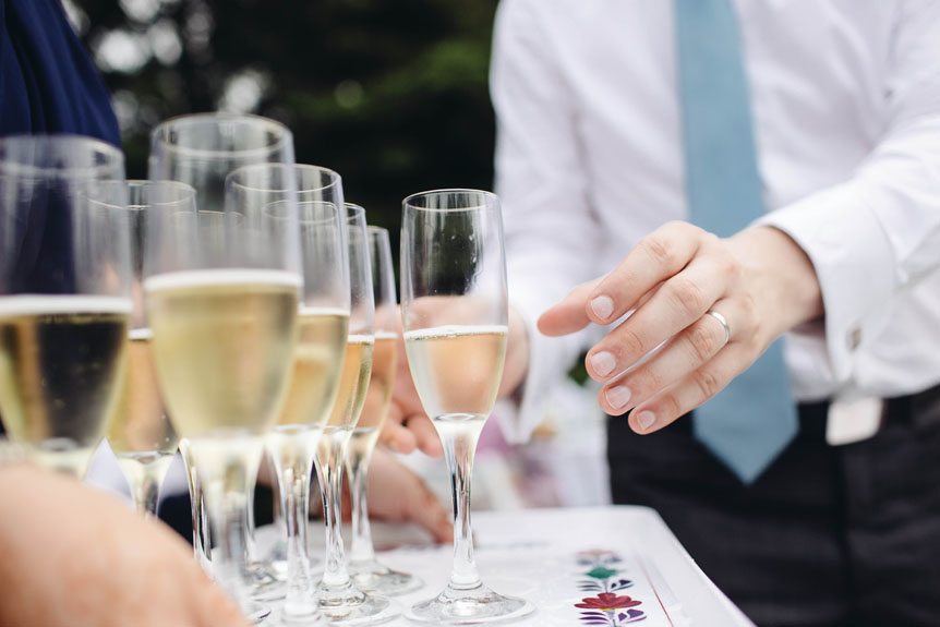 Glasses of champagne at a Toronto backyard wedding.