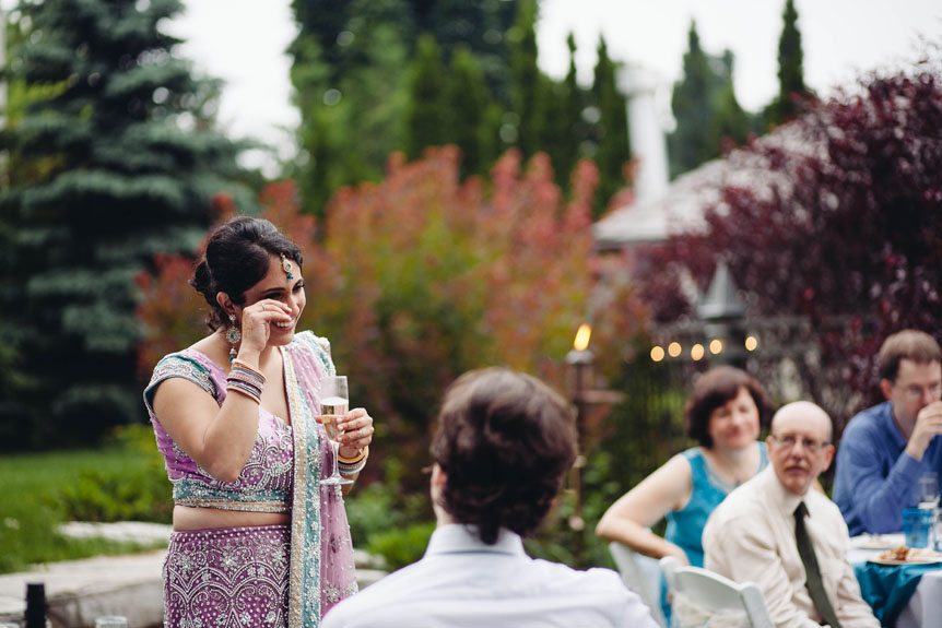 The bride gets emotional at her intimate backyard wedding.
