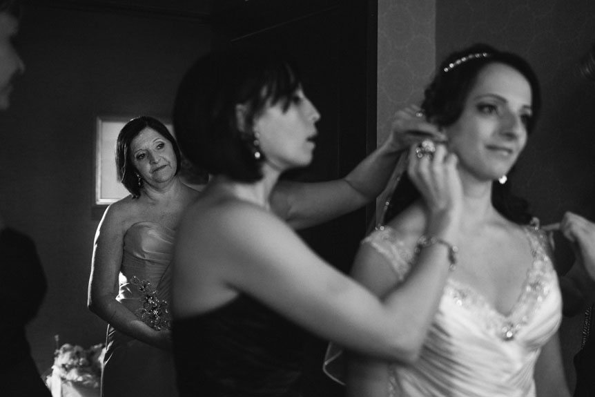 Mother of the Bride watches on as the bride gets ready.