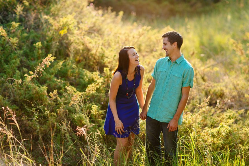 An engaged couple having a great time during their engagement session.