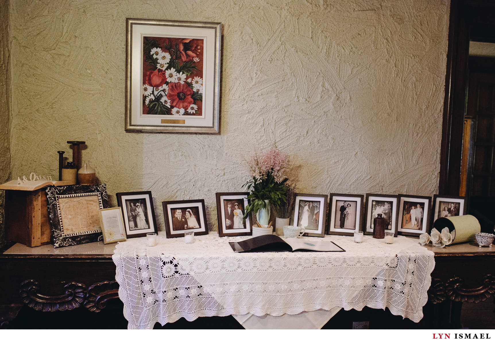 Photos of family members displayed at a wedding in Windermere Manor