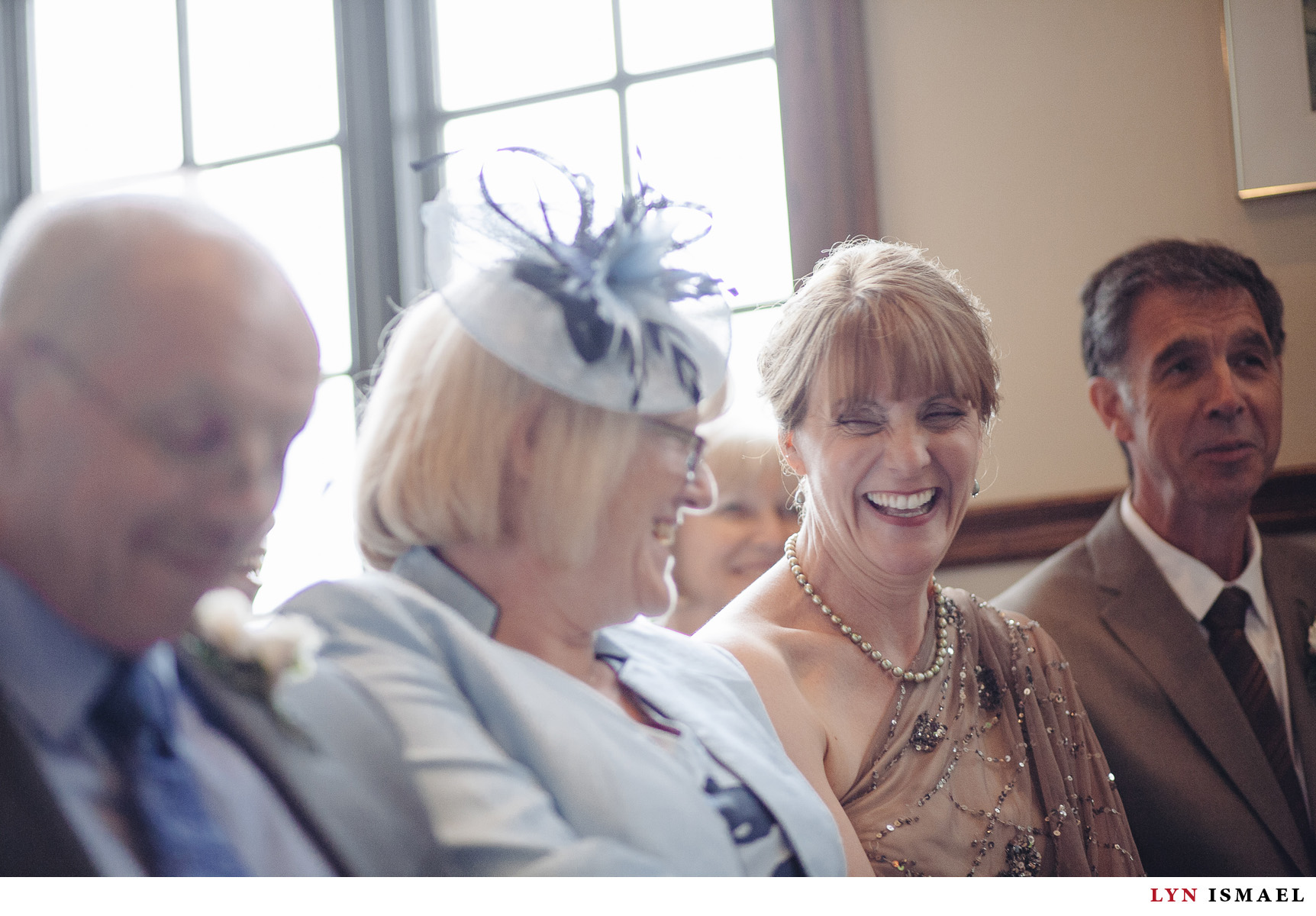 A candid moment betweehn the mother of the groom and mother of the bride at a Windermere Manor wedding ceremony.