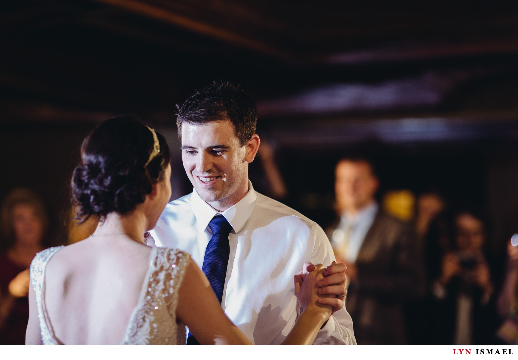Handsome groom dance with his beautiful bride at a Windermere Manor wedding.