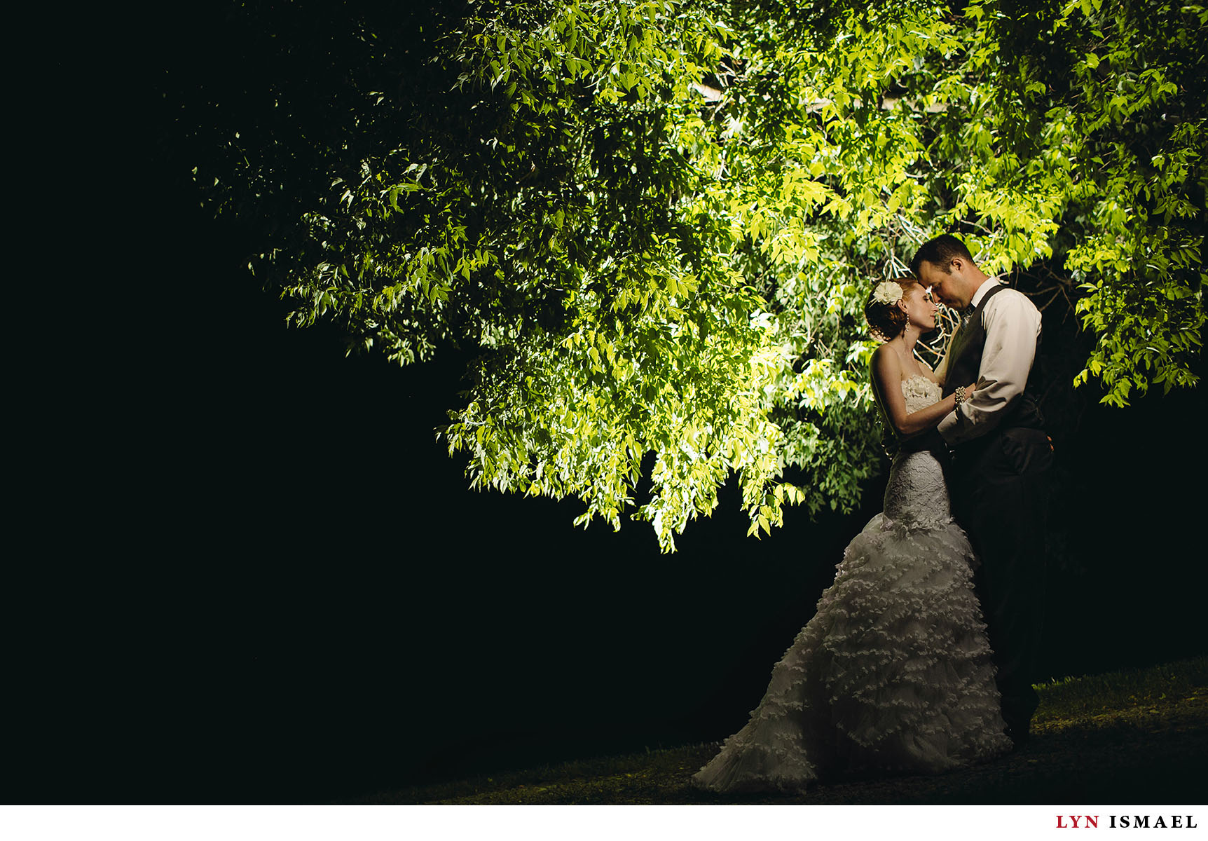A dramatically lit portrait of the bride and groom at Nithridge Estate.