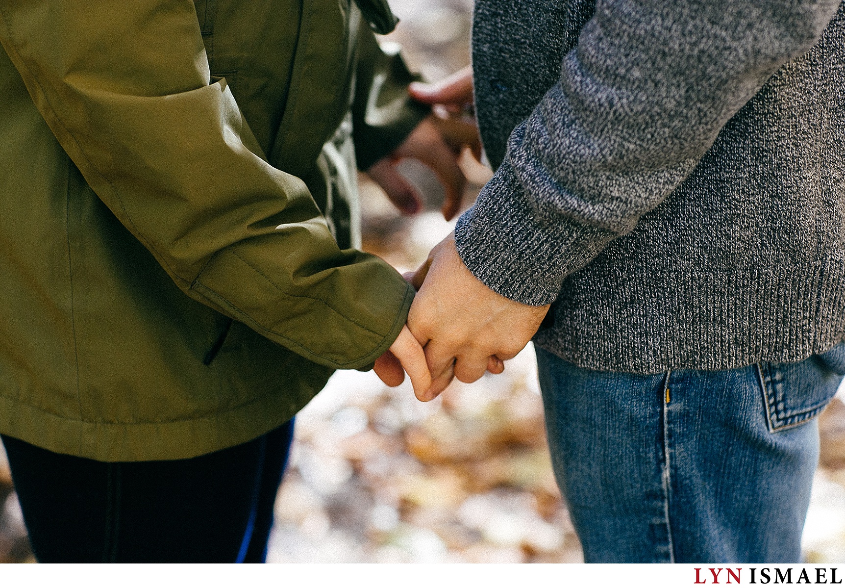 A couple holding hands at an engagement session in Waterloo, Ontario