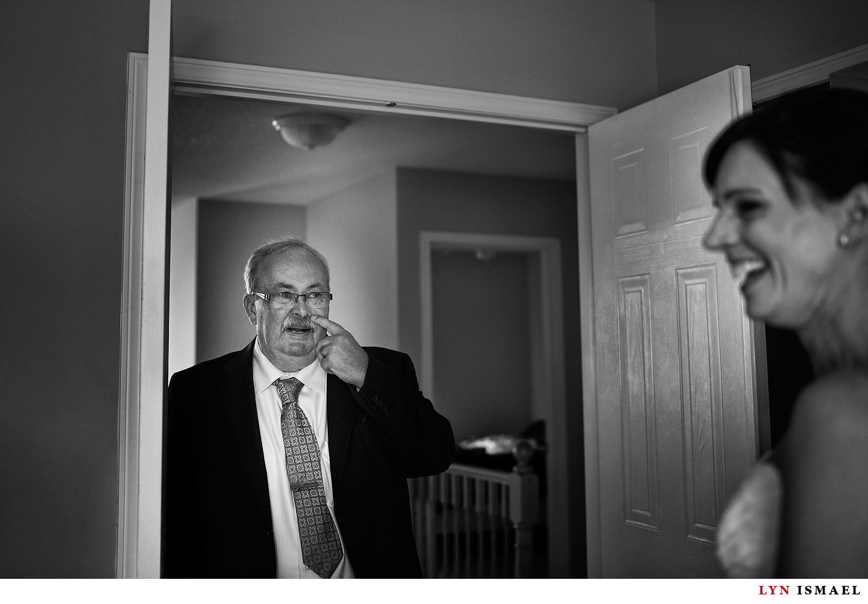 The father of the bride gets emotional upon seeing his daughter as a bride for the first time.