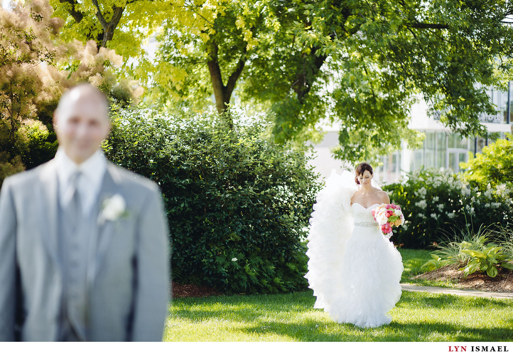 The bride sneaks up behind the groom.