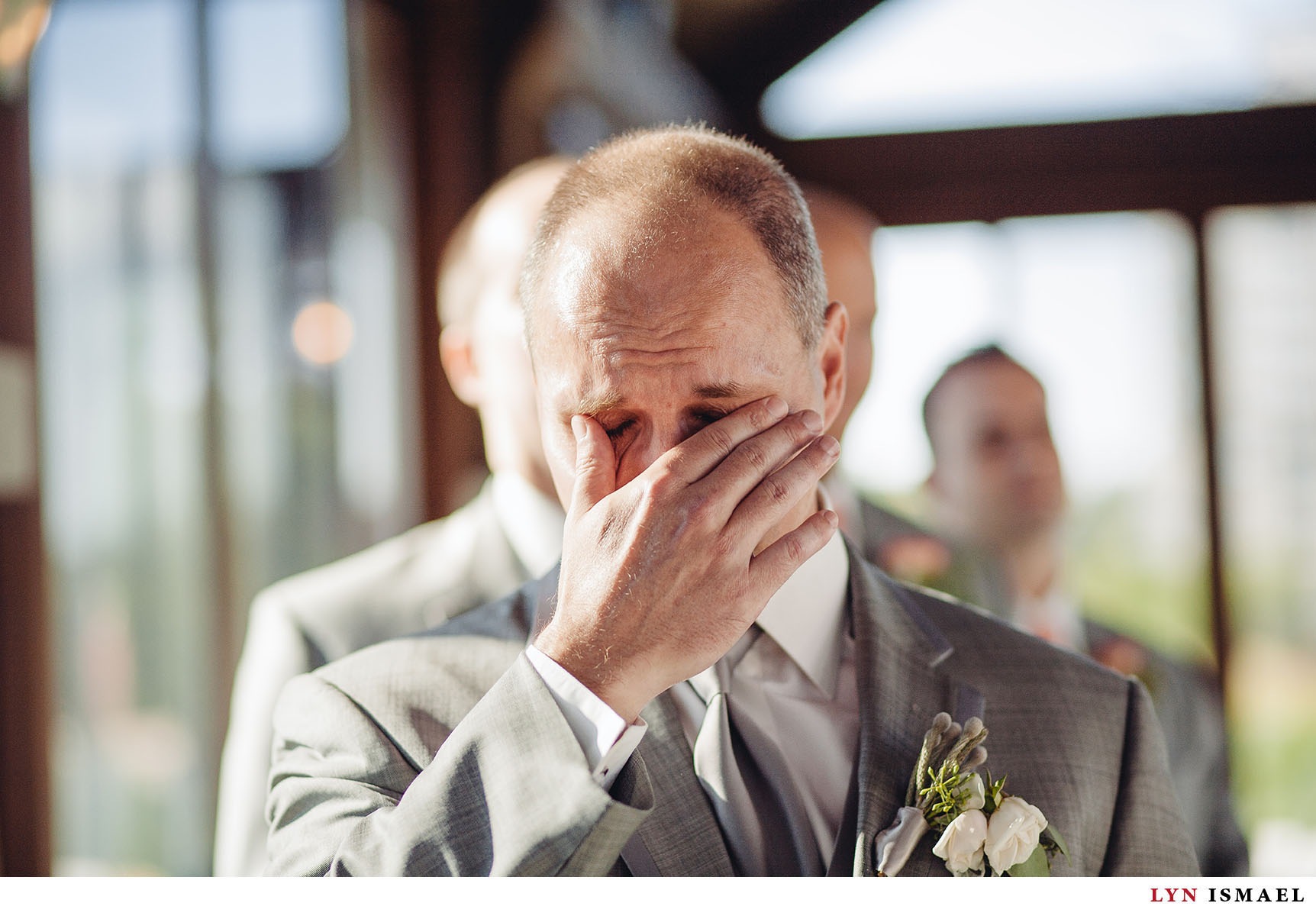 A groom gets emotional as he sees his bride walk down the aisle at the Cambridge Mill.