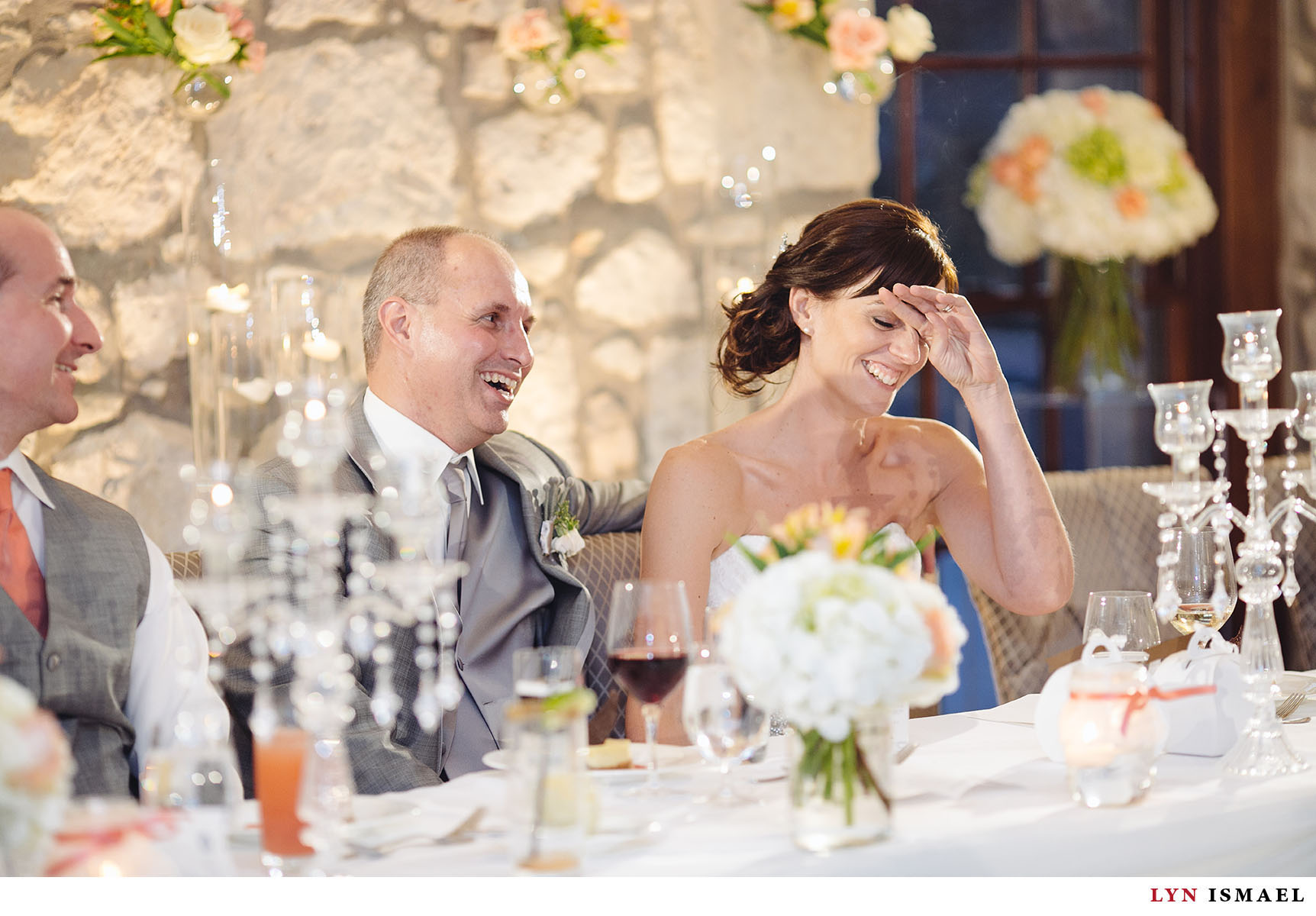 The bride reacted with laughter at a speech.