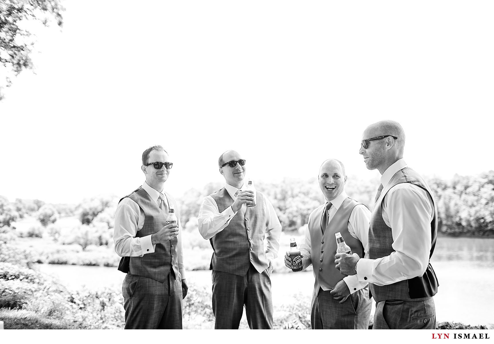 A candid moment between the groom and his groomsmen