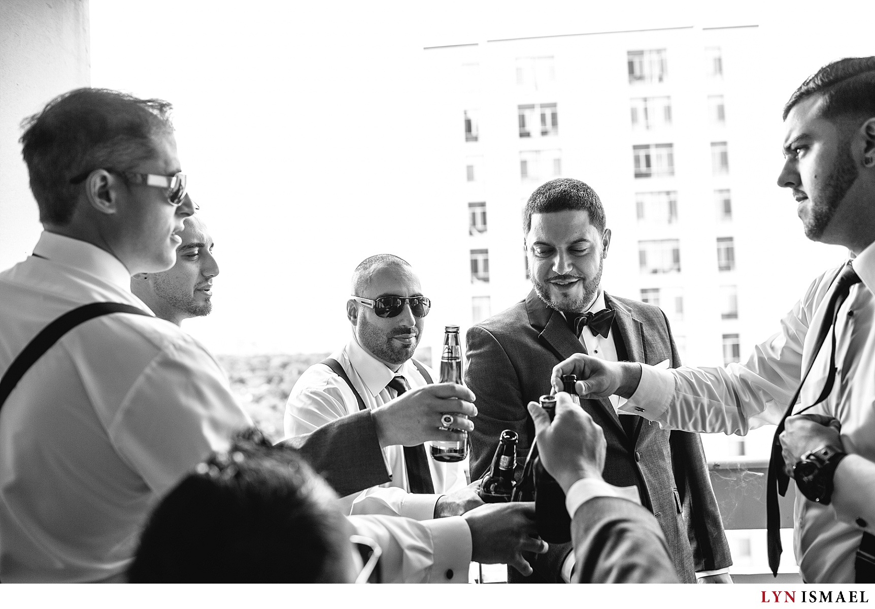 The groom toasting with his groomsmen before the wedding ceremony
