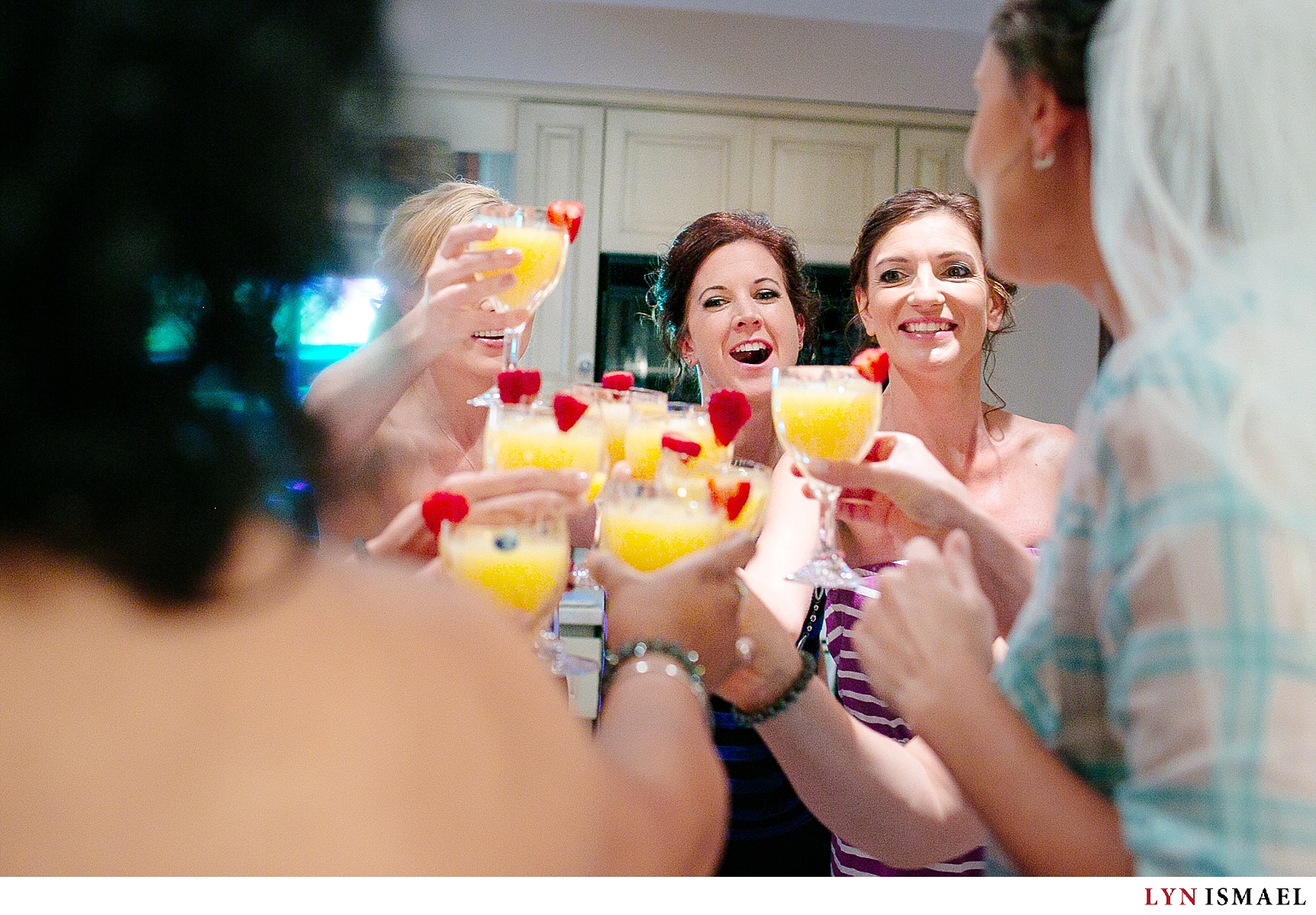 The bride and her bridesmaids share a toast.