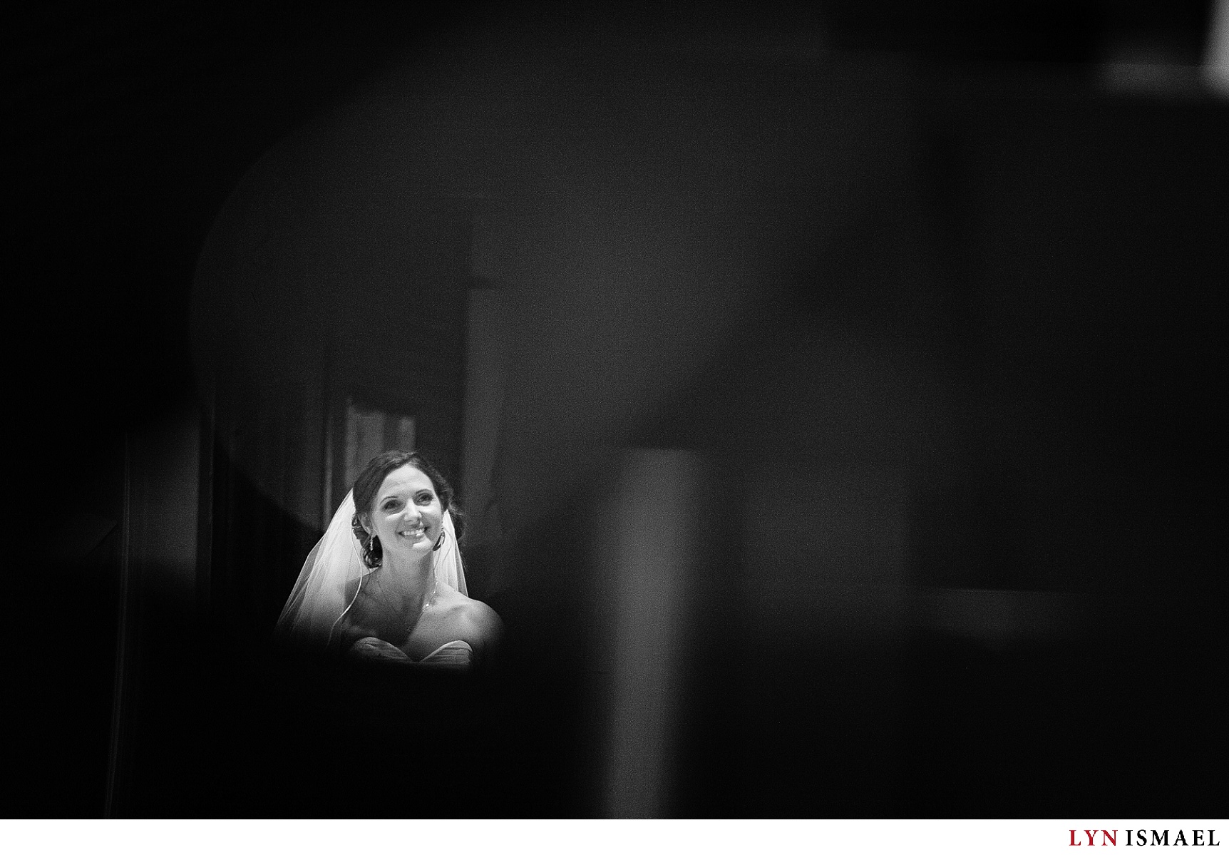 A candid portrait of the bride during her wedding ceremony.