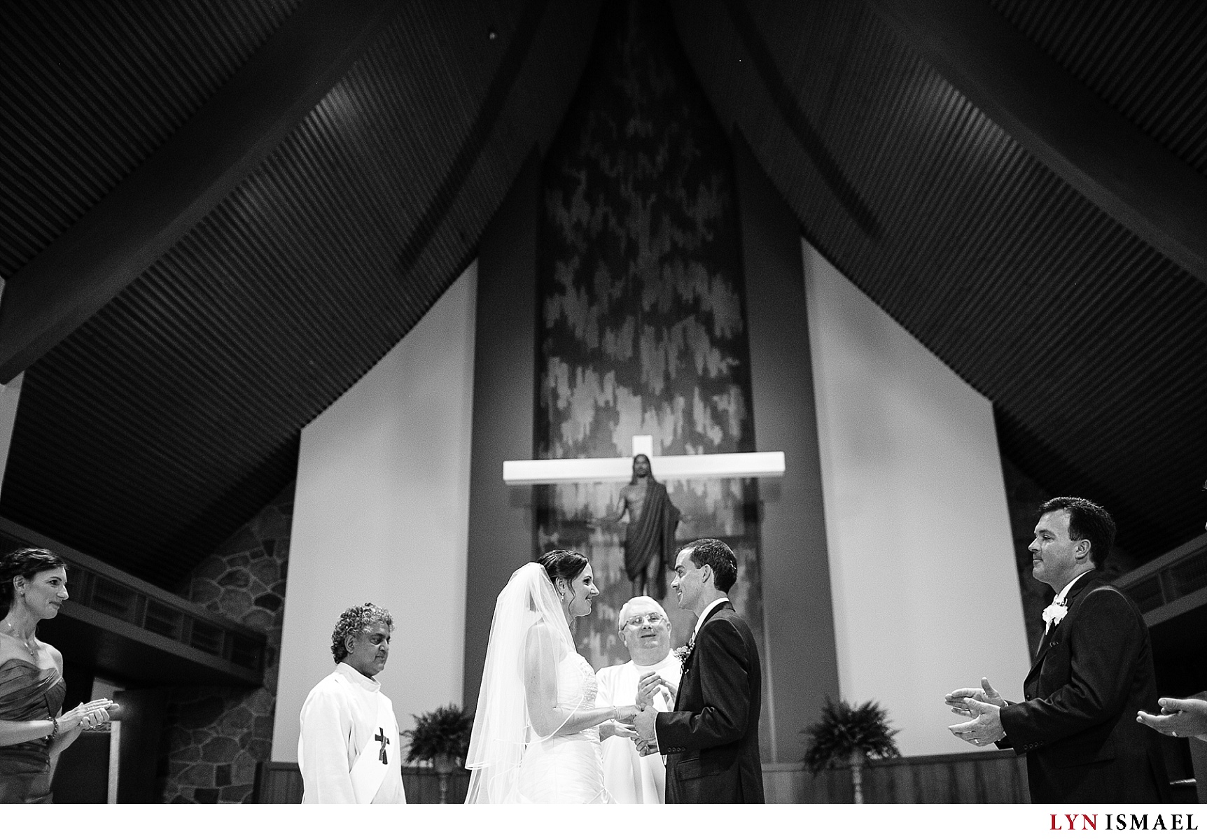 A wedding ceremony inside a Roman Catholic Church.