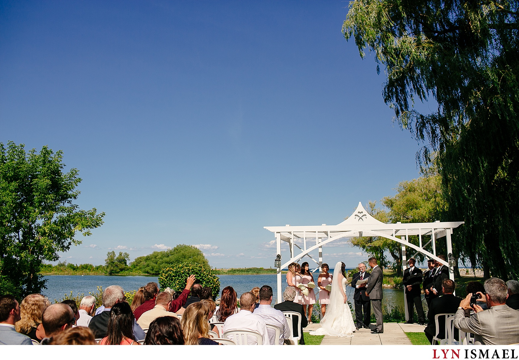 The bride and groom get married at the ceremony venue of Cranberry Resort  in Collingwood.