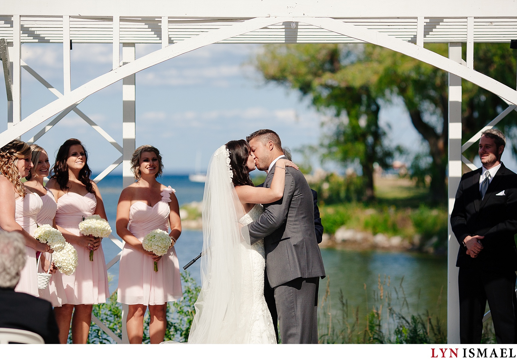 First kiss of the bride and groom at the Cranberry Resort in Collingwood.