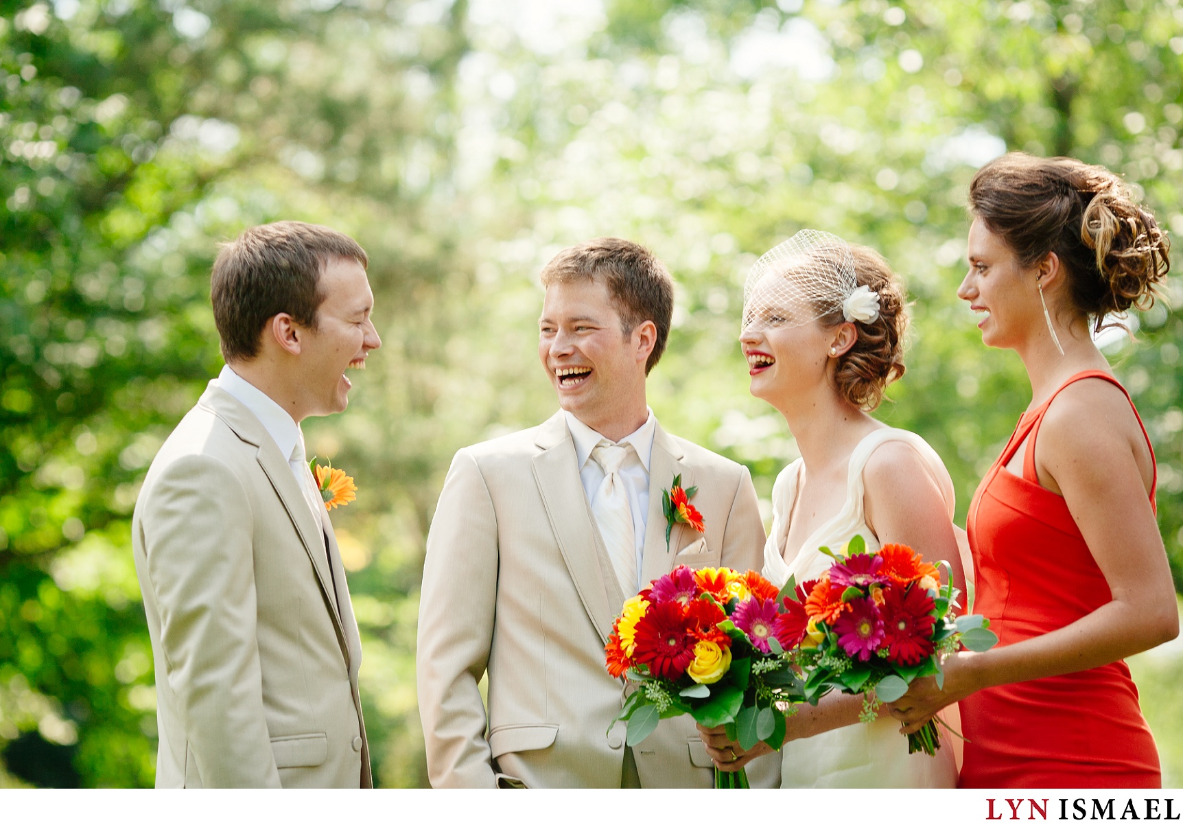 A candid moment with the wedding party at a Belwood Lake wedding.