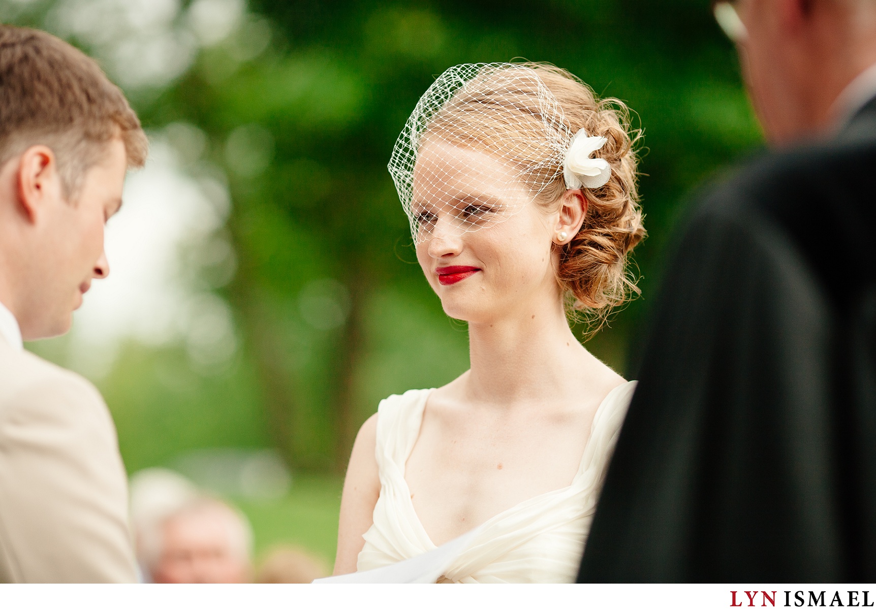 Beautiful bride listens to her groom's vows.