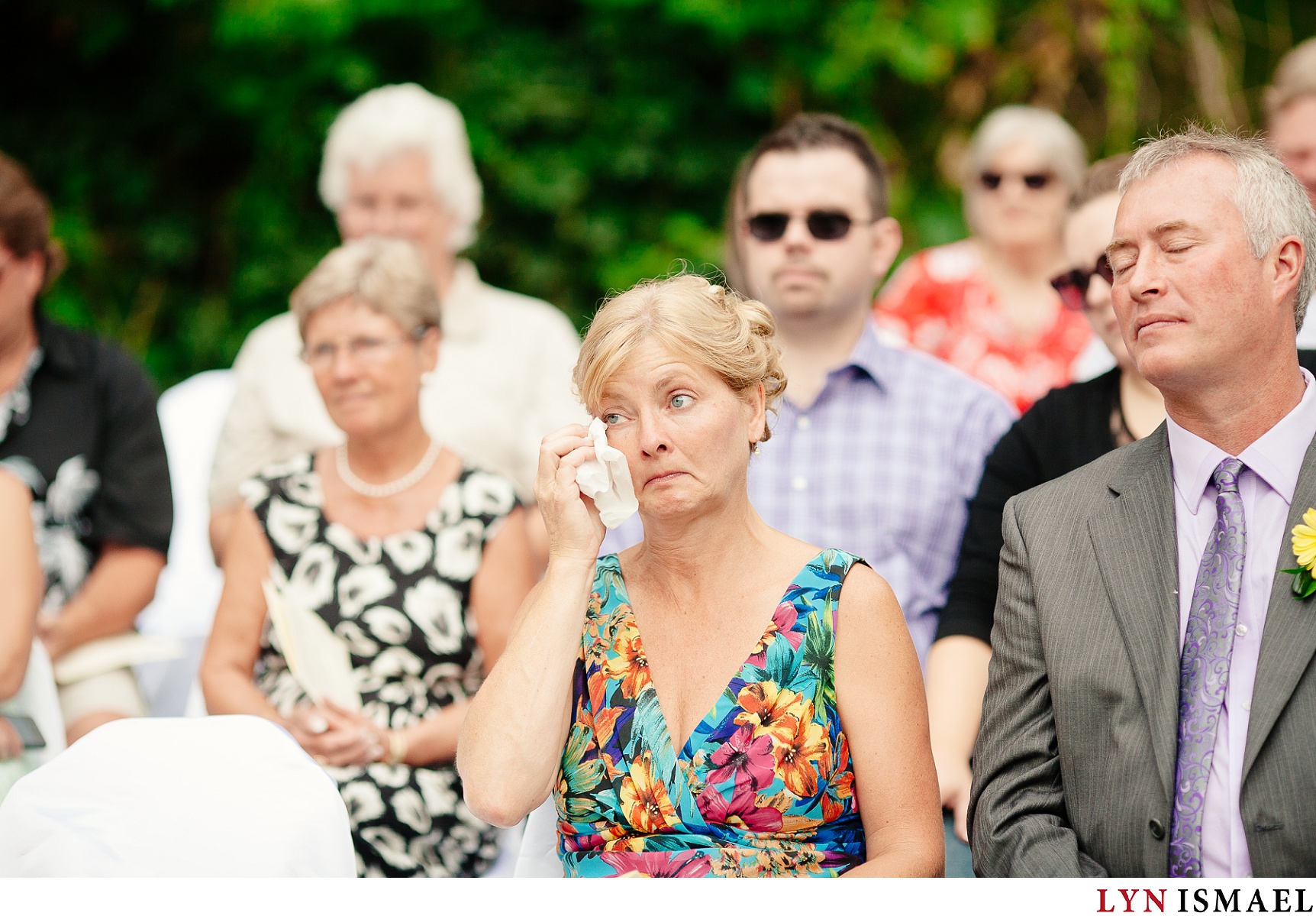 Groom's mom cries at his wedding.