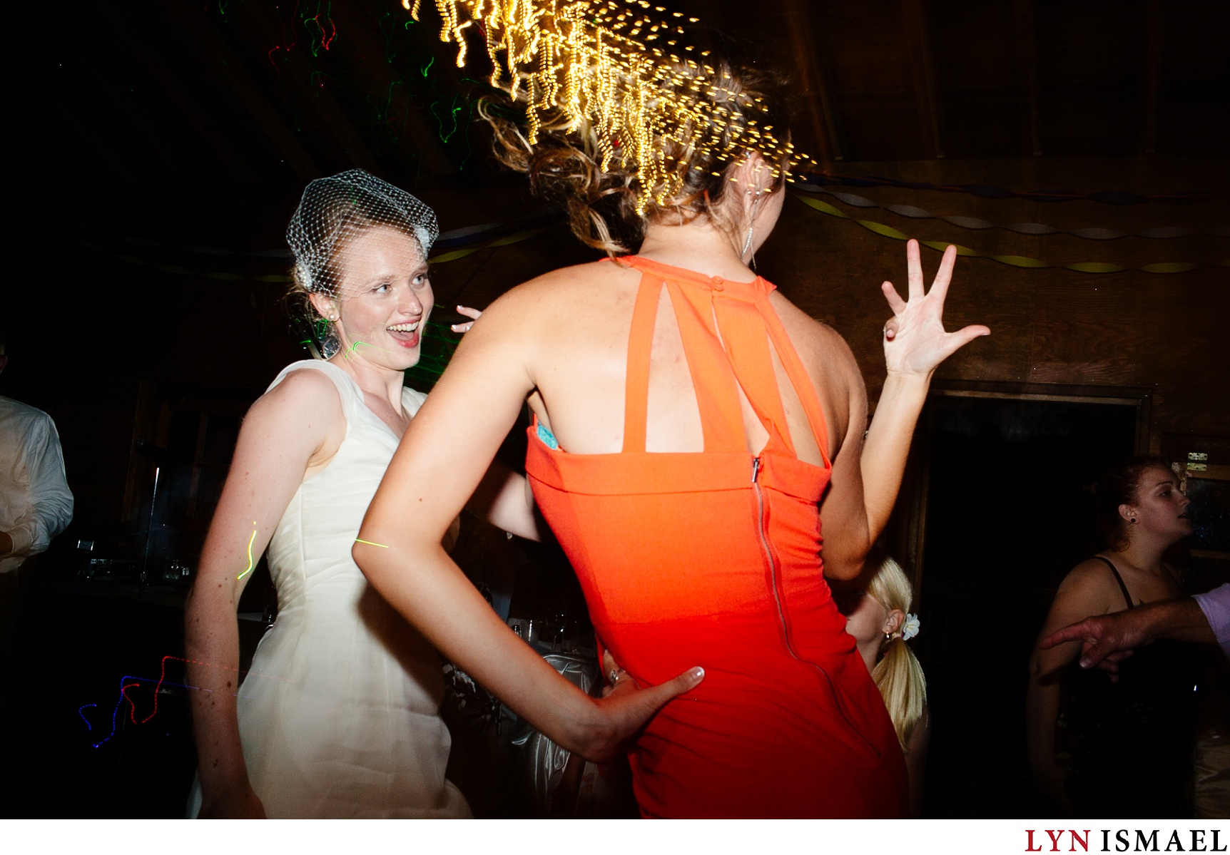 Bride and her sister dances at a Hampton Barn wedding reception.