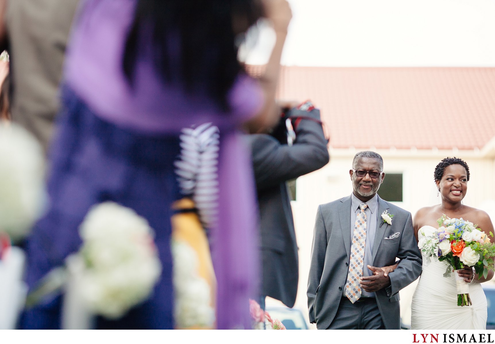Bride walks down the aisle with her father at a Holland Marsh Wineries wedding.