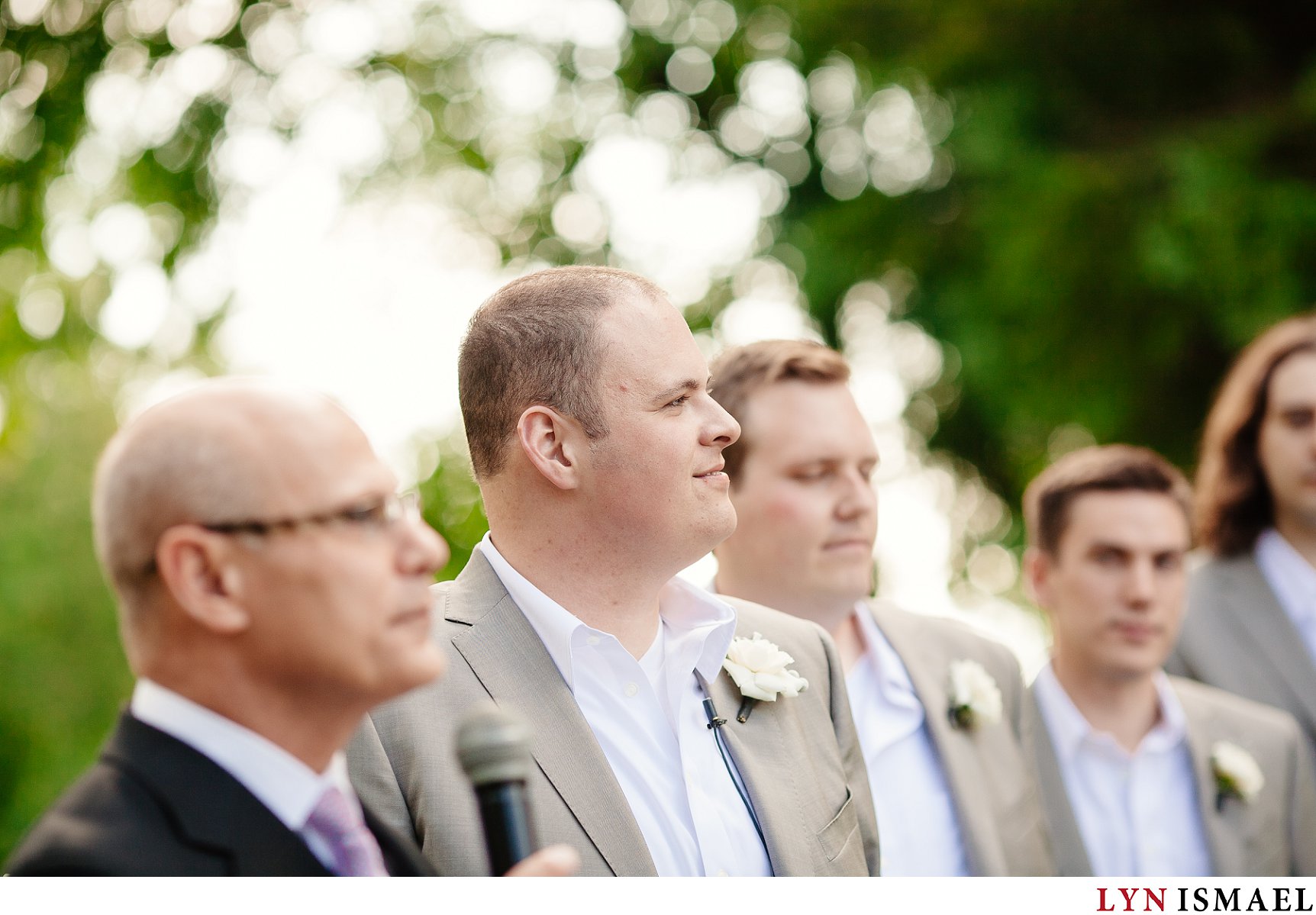 Groom watches his bride walk down the aisle at a Holland Marsh Wineries wedding.