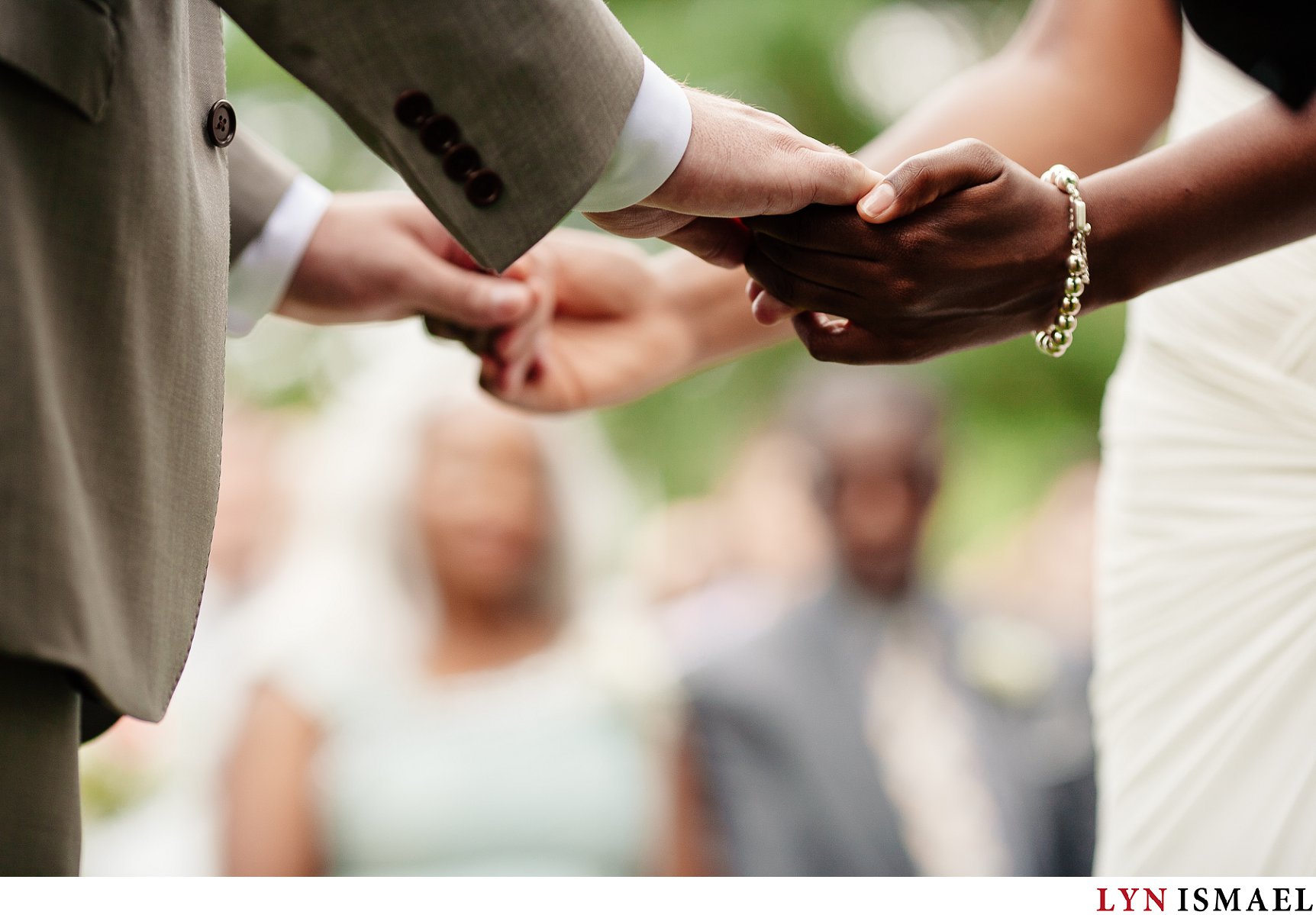 Bride and groom held hands at their ceremony during their Holland Marsh Wineries wedding.