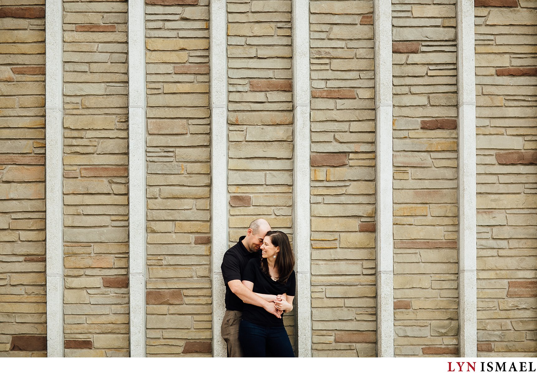 Graphic lines framing a couple at their engagement session.