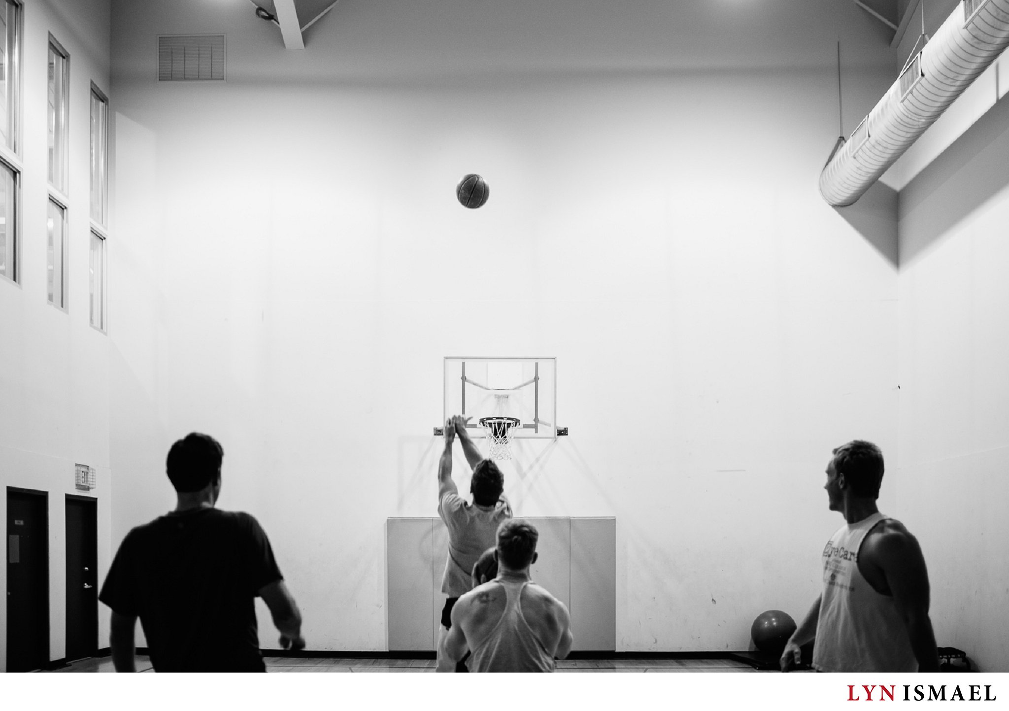 Groomsmen shooting hoops at the White Oaks Resort's basketball court in St. Catherine's, Ontario
