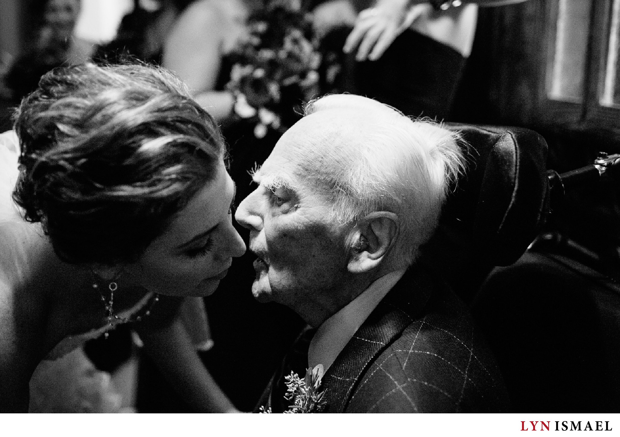 Bride greets her grandfather before she walks down the aisle at St George's Church in St. Catherine's, Ontario.
