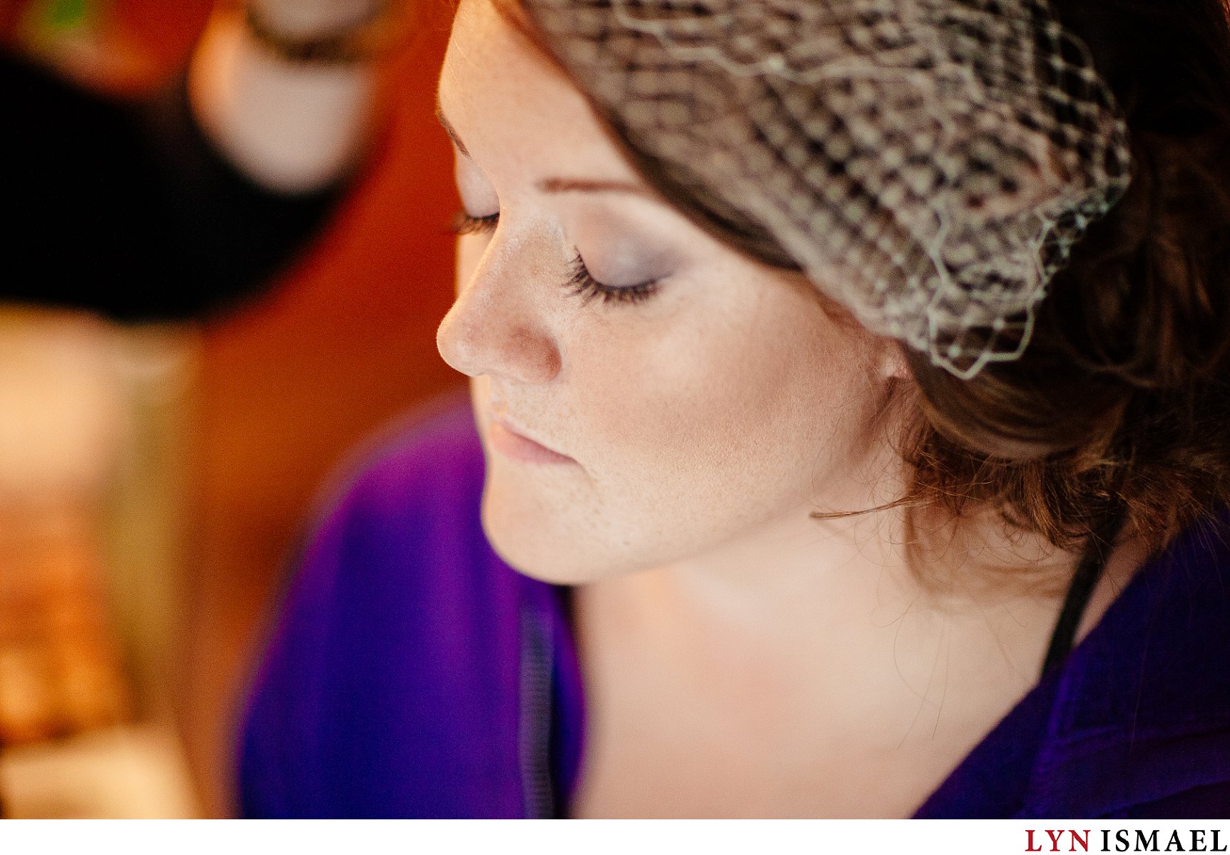 The bride getting her makeup done before her wedding ceremony at Cutten Fields in Guelph.