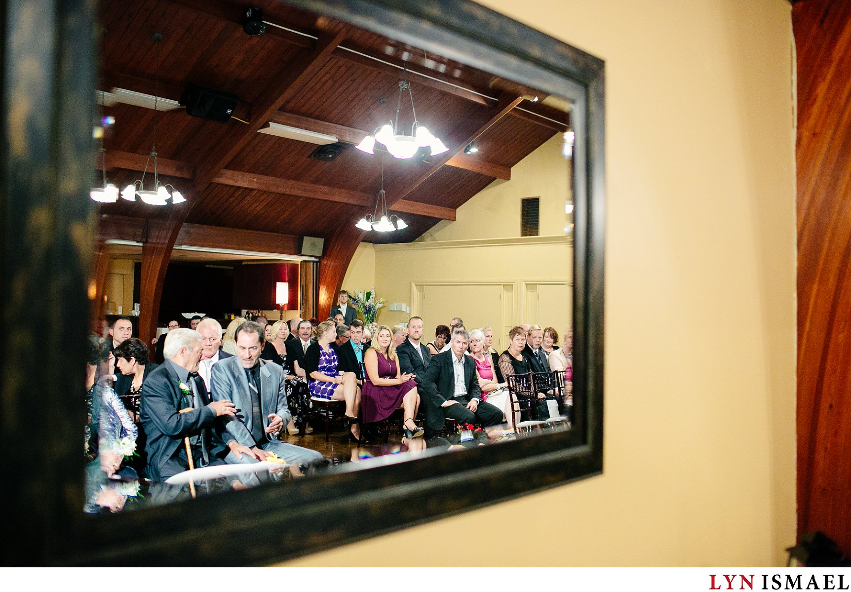 People waiting at an indoor wedding ceremony at the Cutten Fields in Guelph.