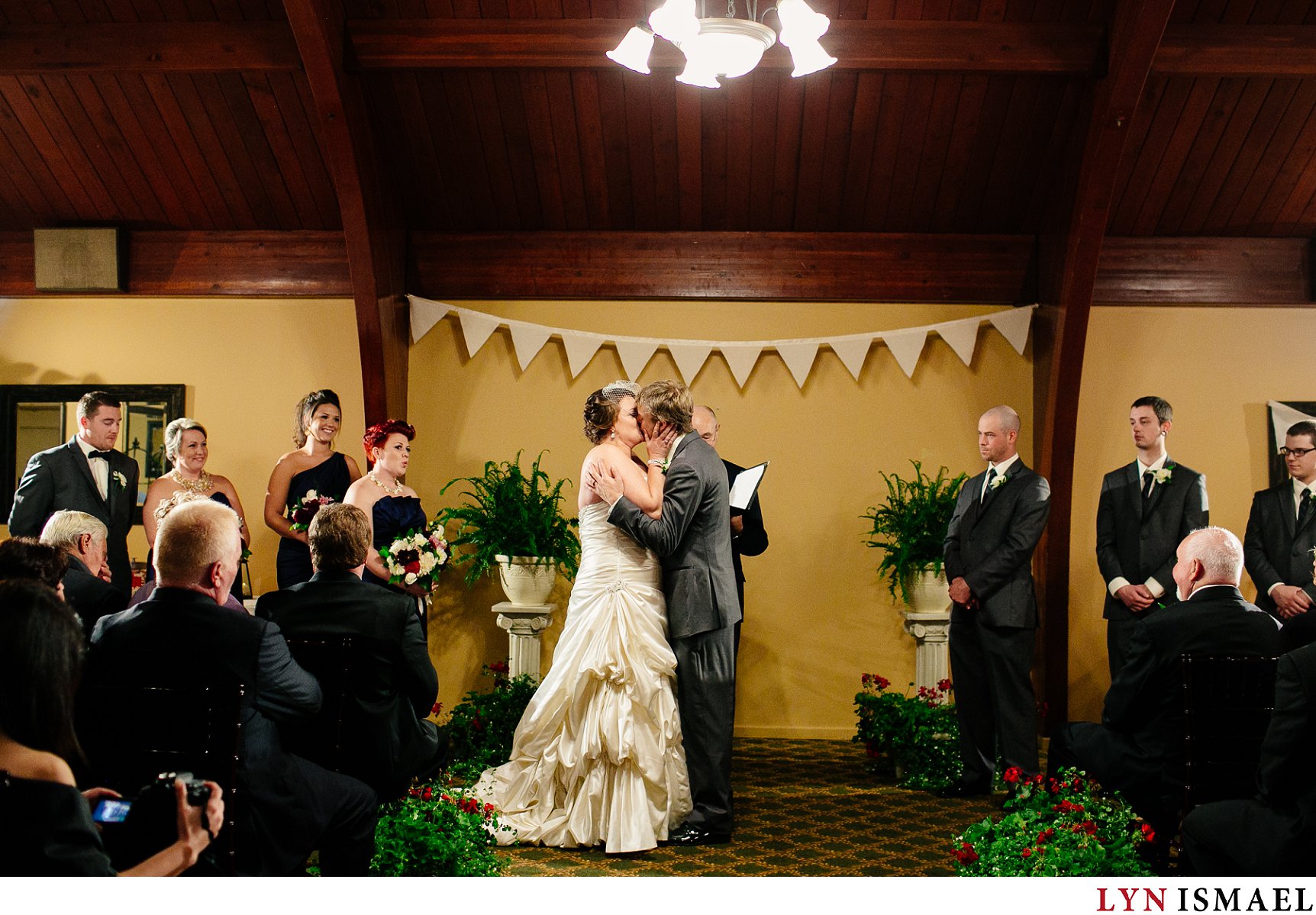 The first kiss at an indoor wedding ceremony at the Cutten Fields in Guelph.