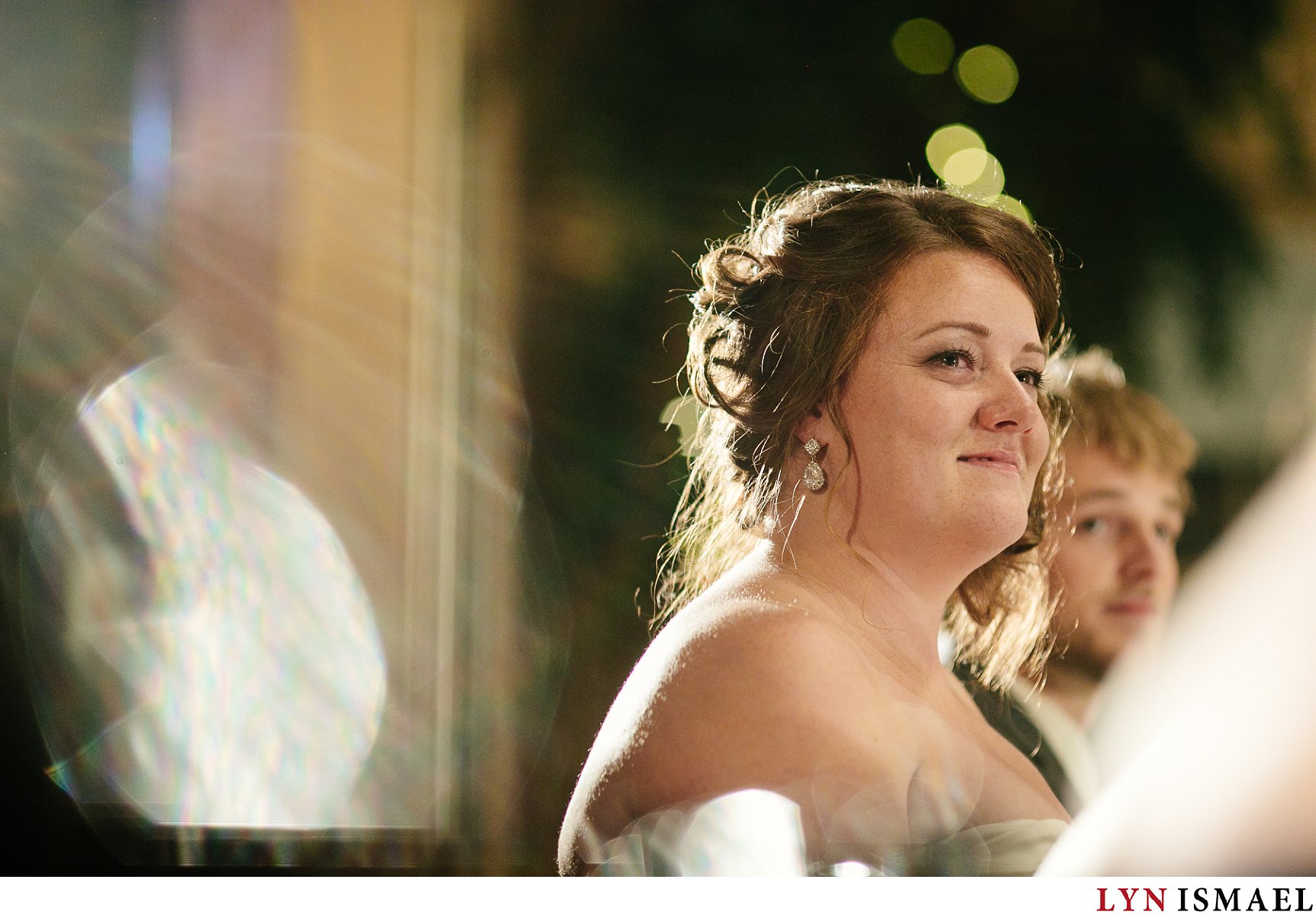 An emotional moment captured of the bride listening to her parent's speech.