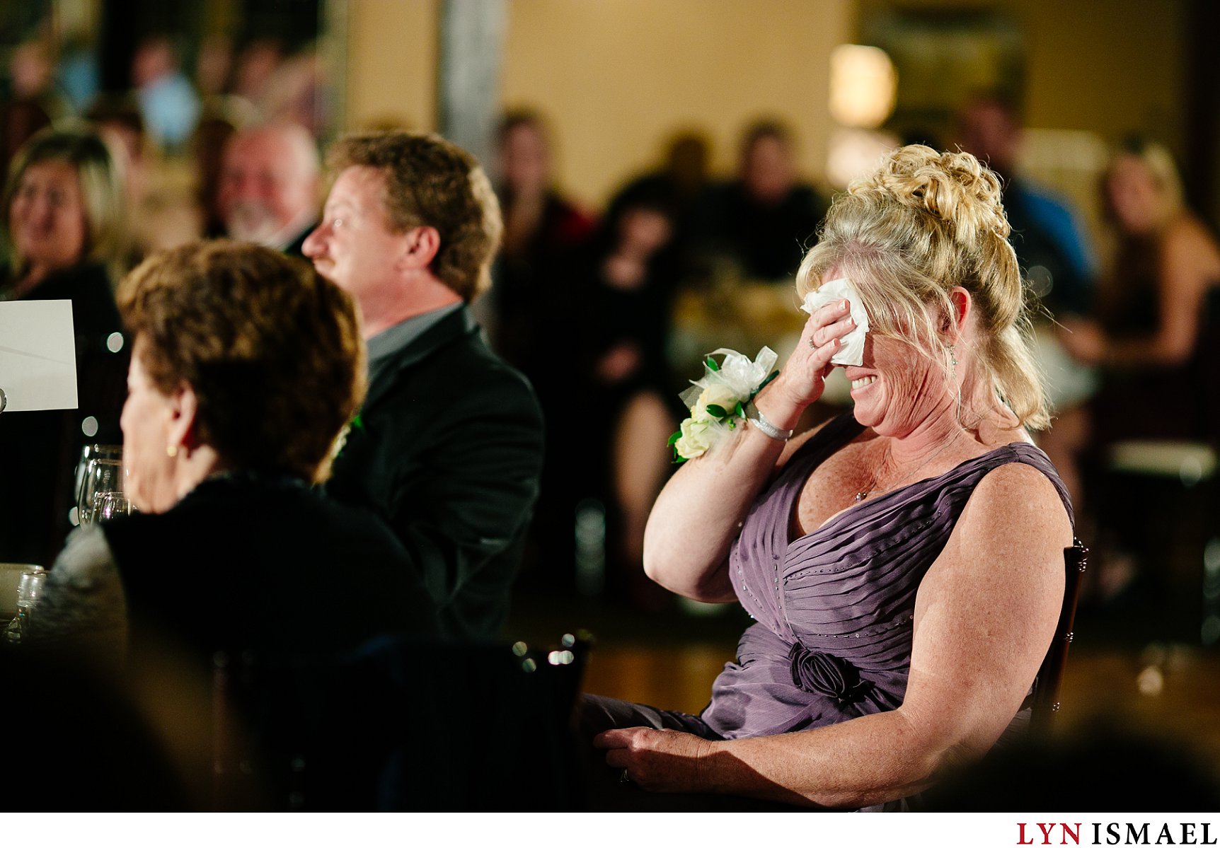 Mother of the bride reacting to her daughter's speech.