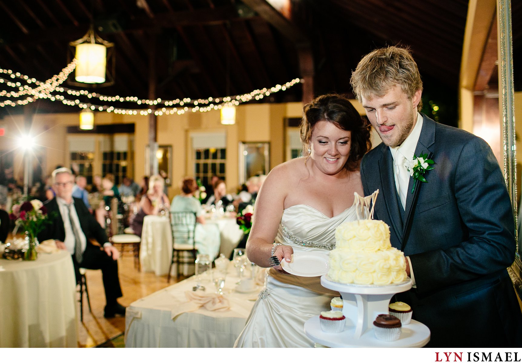 Bride and groom cuts their cake.