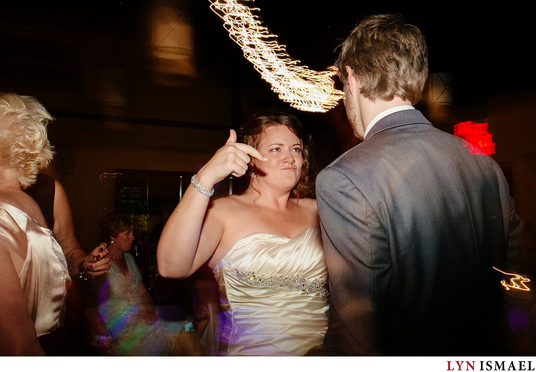Bride and groom dances to the tunes.