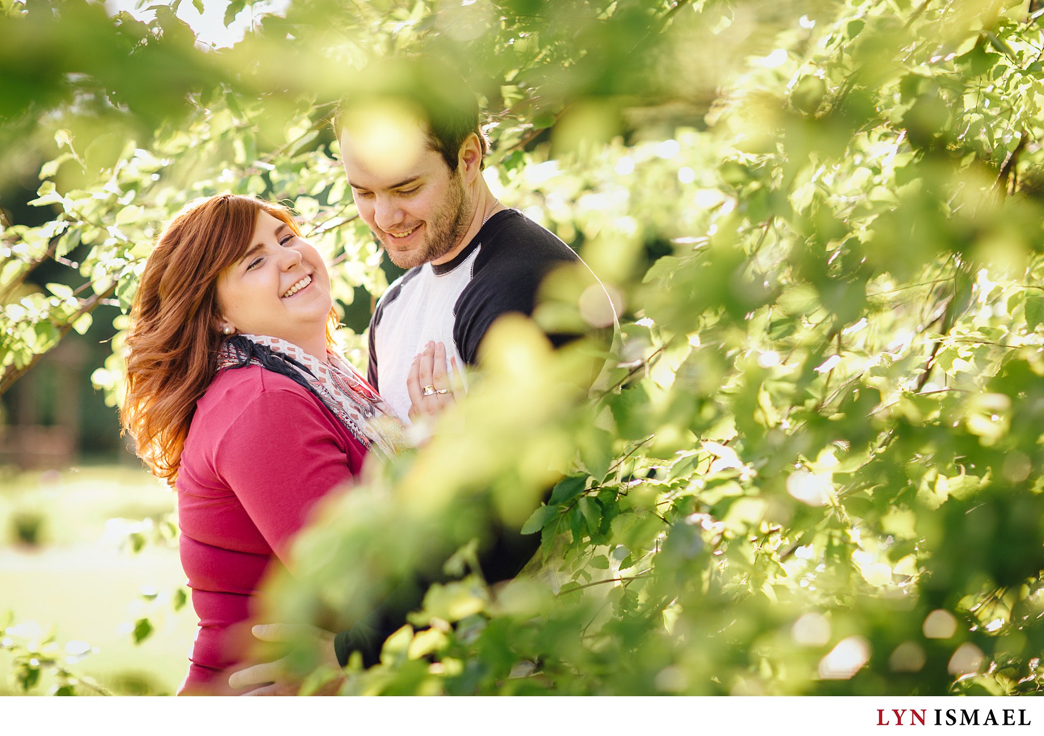 A happy photograph taken at a couple's engagement session at the Arboretum in Guelph, Ontario.