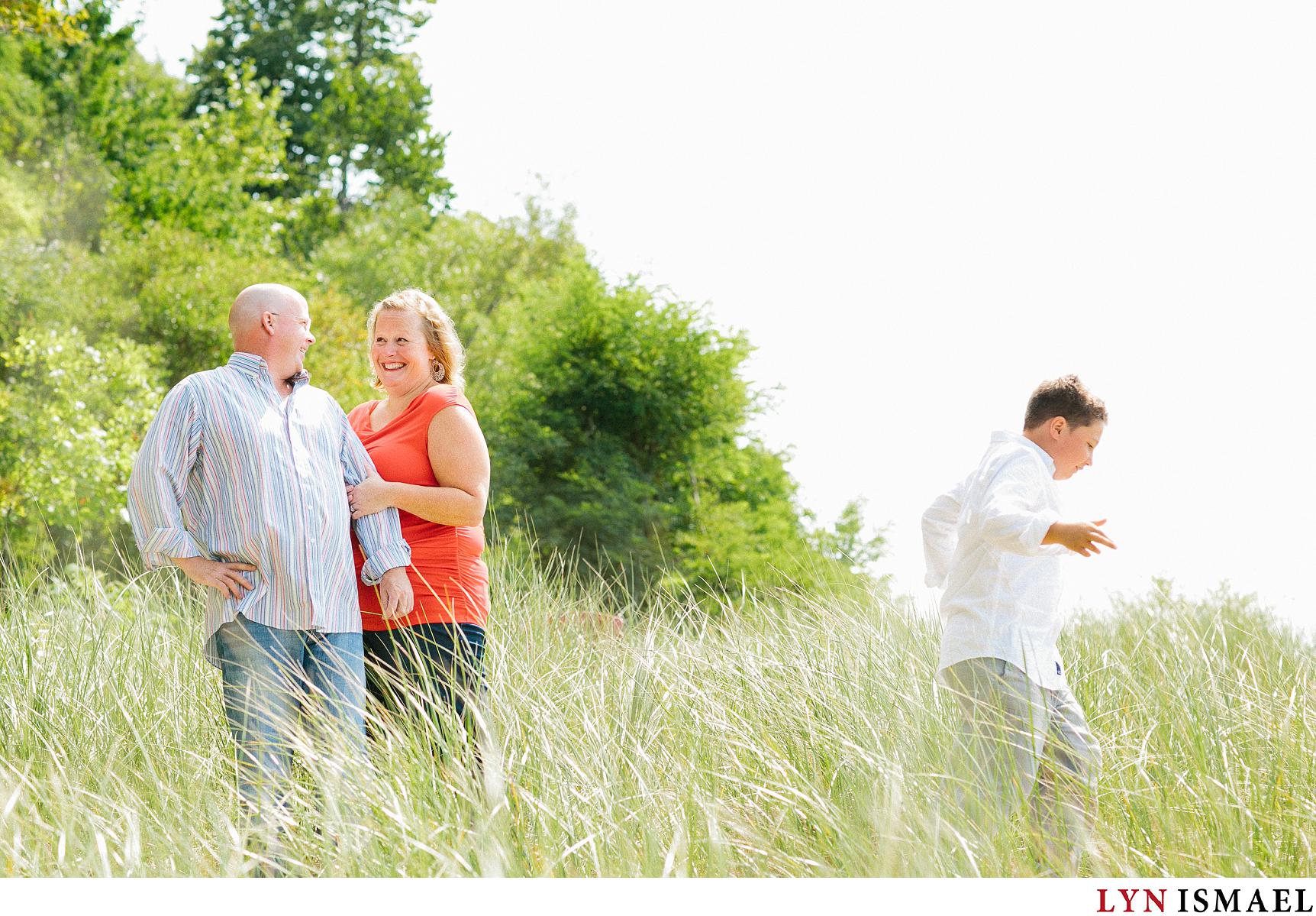 A couple have an engagement session on the beach in Bayfield, Ontario